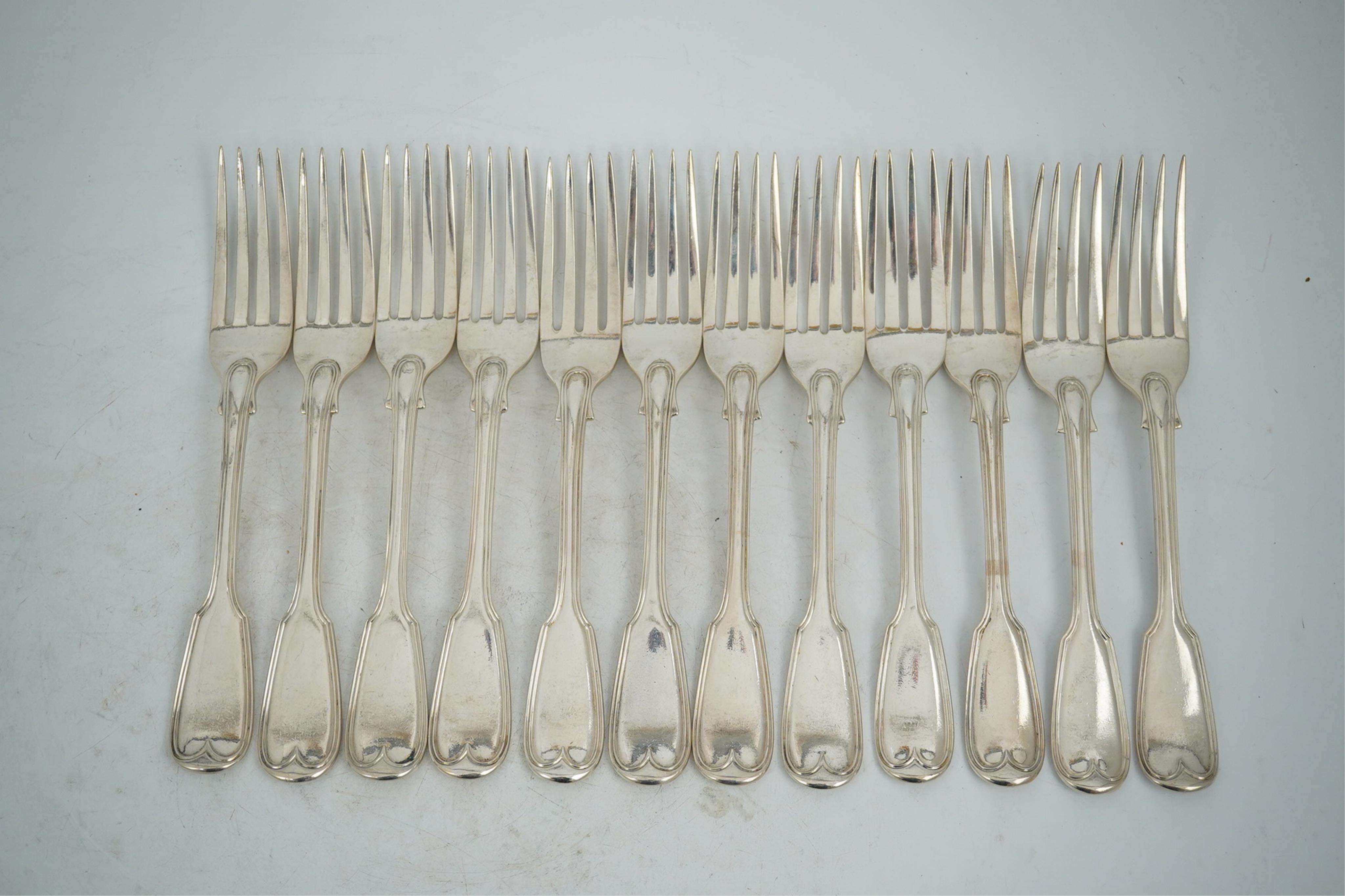 A set of twelve William IV silver double struck fiddle and thread pattern table forks, William Chawner II, London, 1831, 34.2oz.